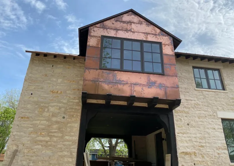 Copper metal panel facade on a stone building for Metal Roof Coating in Guadalupe