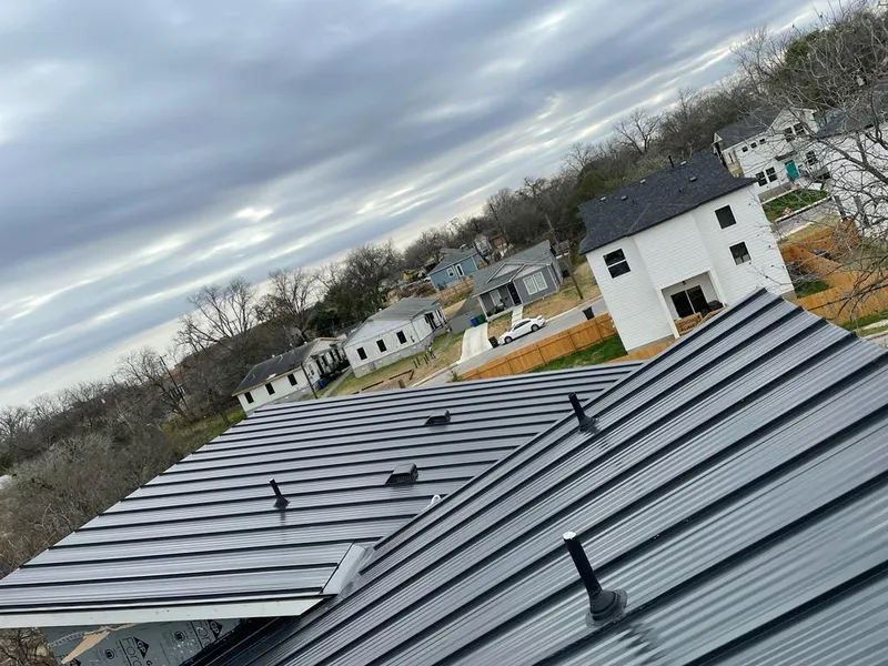 Standing seam metal roof panels with vents for Skylight Repair in Guadalupe